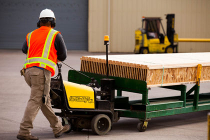 yard employee moving i joists