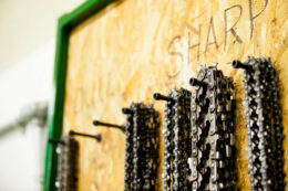 board of sharps with varying sizes of chains hanging from it