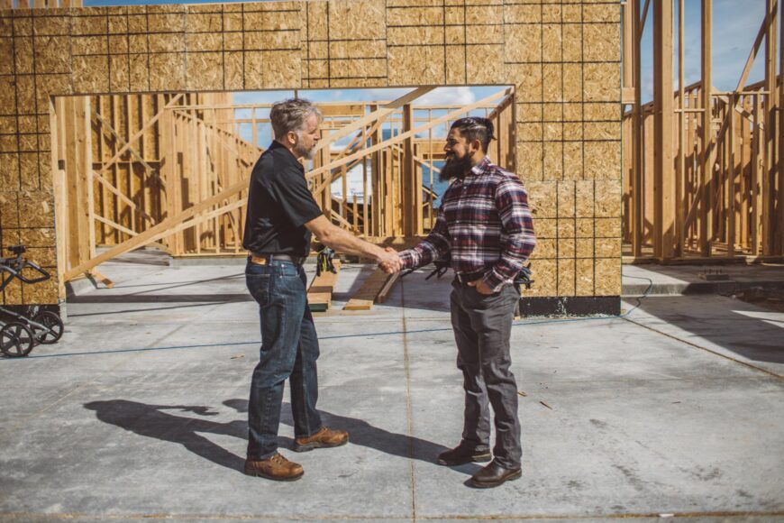 Shaking hands on construction site